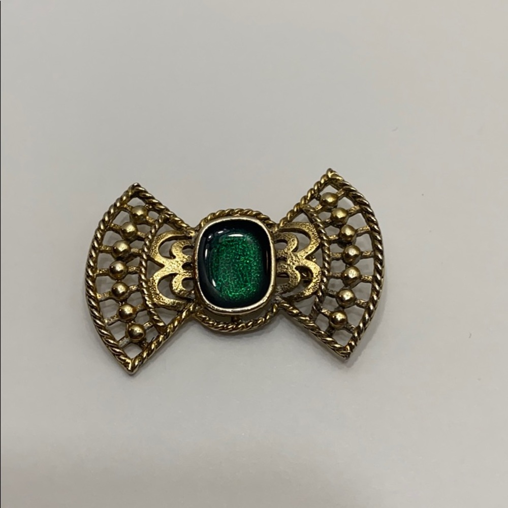 Gold tone bow tie brooch